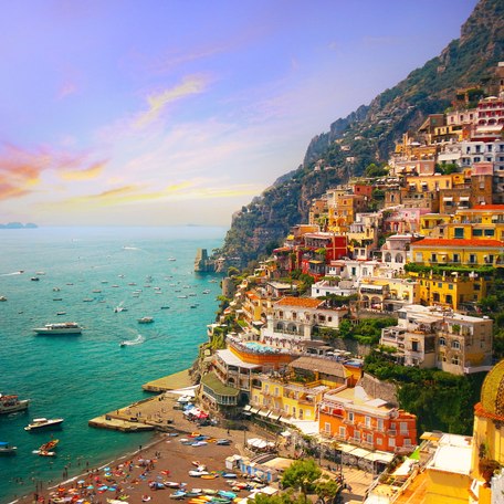 Overview of a stretch of the Amalfi Coast, with luxury yacht charters at anchor