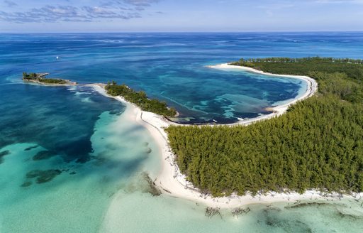 Aerial view of Munjack Cay with bay and beach in Abaco, Bahamas