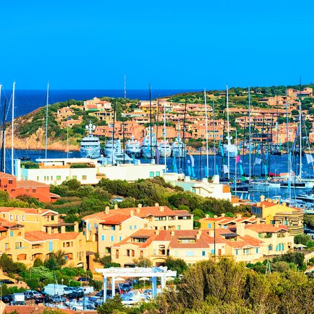 Elevated view of the marina at Porto Cervo, with many charter yachts berthed