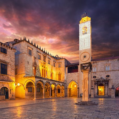 Overview of the exteriors of Sponza Palace at nightfall