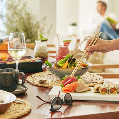 Spread of seafood dishes including sushi 